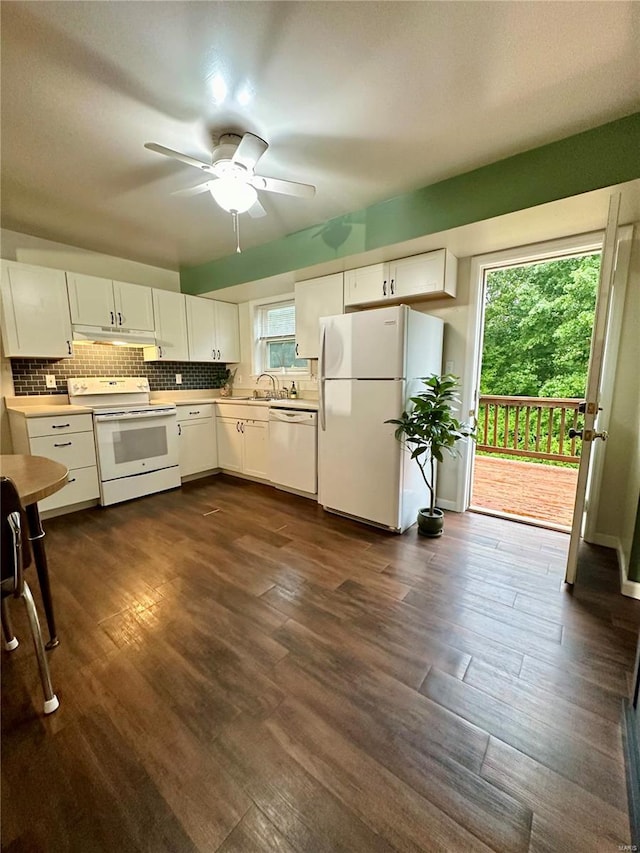 kitchen featuring ceiling fan, backsplash, dark hardwood / wood-style flooring, white cabinetry, and white appliances