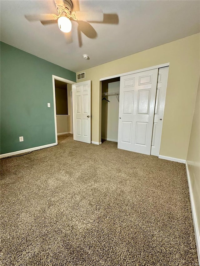 unfurnished bedroom with ceiling fan and carpet flooring