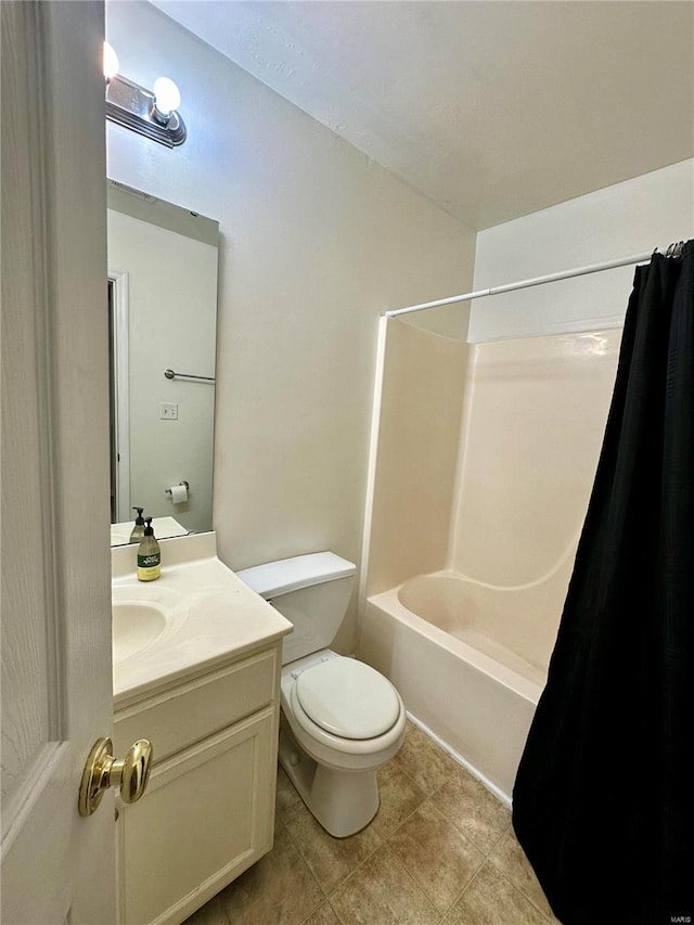 full bathroom featuring toilet, tile patterned floors, shower / tub combo, and vanity