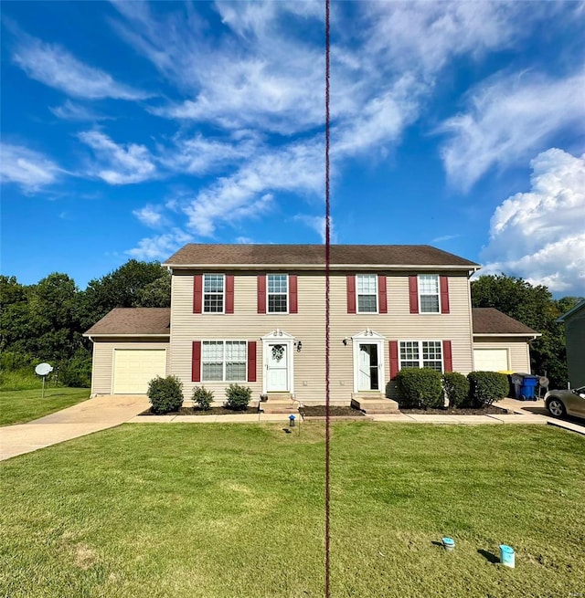 colonial home with a garage and a front lawn