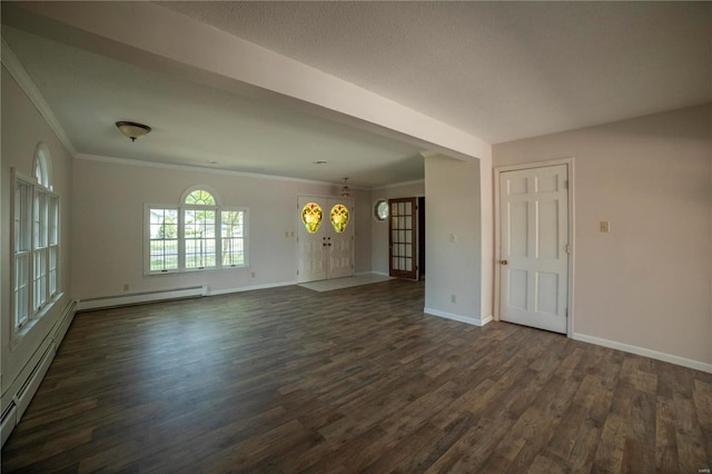 unfurnished room with a baseboard heating unit, crown molding, dark wood finished floors, and baseboards