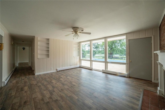 unfurnished living room featuring built in shelves, a fireplace with flush hearth, a ceiling fan, baseboard heating, and dark wood-style floors