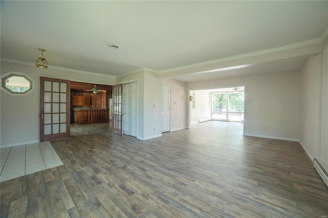 unfurnished living room with a baseboard heating unit, wood finished floors, baseboards, french doors, and crown molding