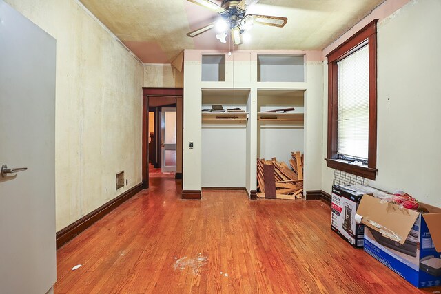 interior space featuring ceiling fan and wood-type flooring