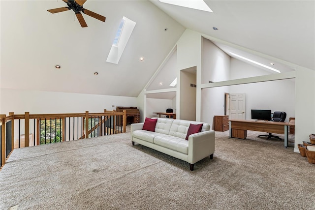 carpeted living area featuring a skylight, ceiling fan, and high vaulted ceiling