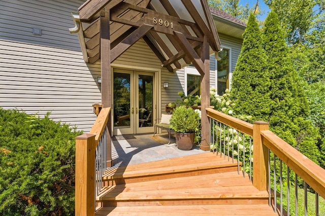 wooden terrace featuring french doors