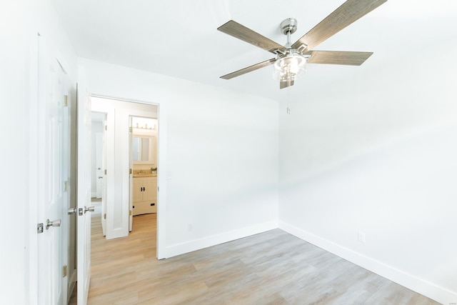 unfurnished room featuring light wood-type flooring and ceiling fan