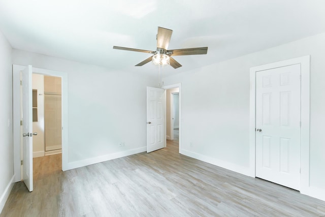 unfurnished bedroom featuring light wood-type flooring and ceiling fan