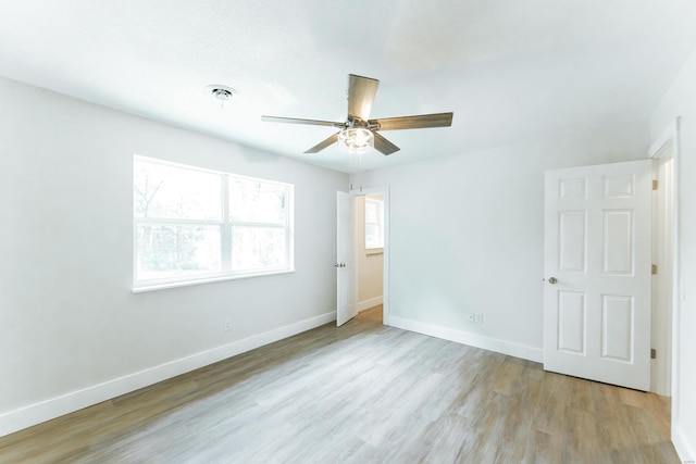 unfurnished room featuring ceiling fan and light hardwood / wood-style flooring