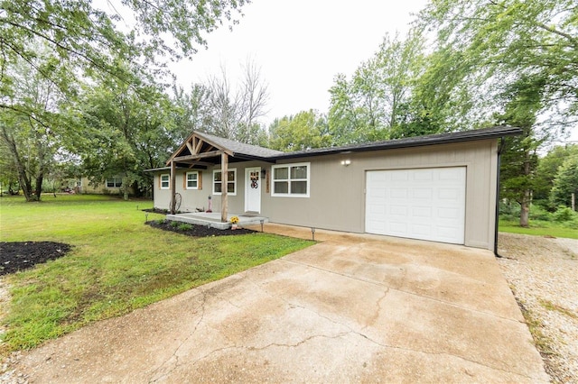 view of front of house with a garage and a front lawn