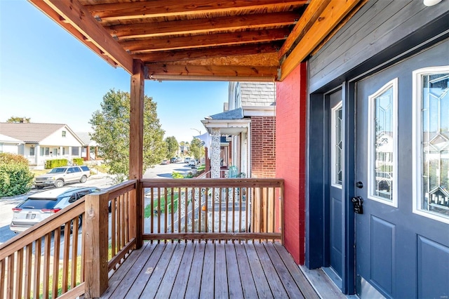 wooden terrace featuring covered porch