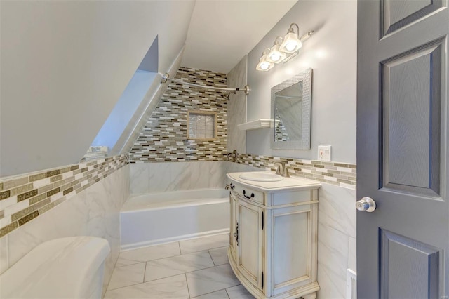 bathroom featuring vanity and tile walls