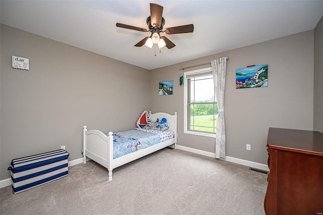 unfurnished bedroom featuring ceiling fan and carpet