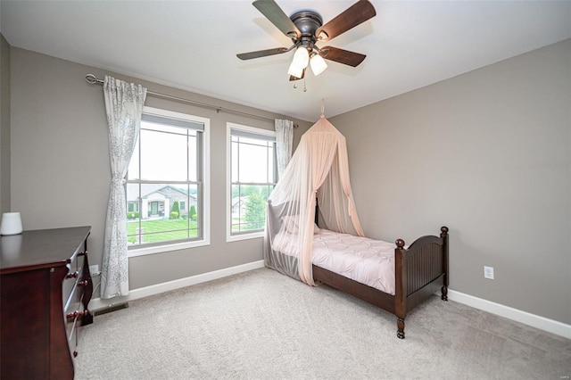 carpeted bedroom with ceiling fan