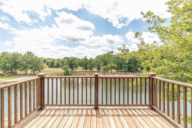 wooden deck featuring a water view