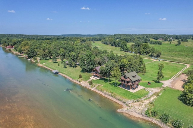 bird's eye view featuring a water view, a wooded view, and a rural view