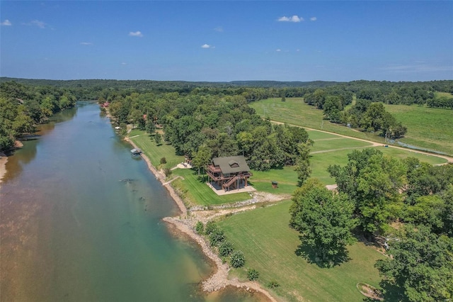 aerial view with a water view, a wooded view, and a rural view