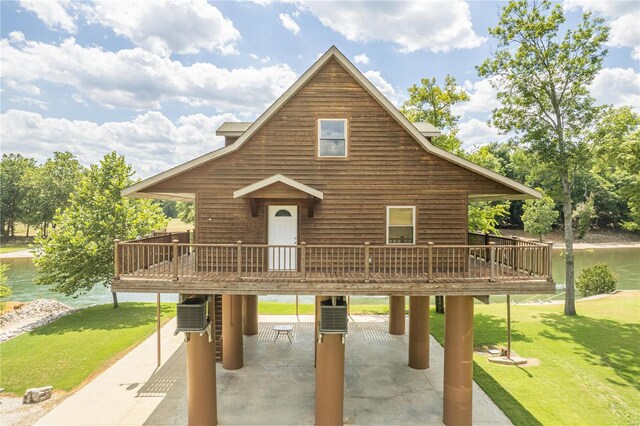 exterior space featuring a deck and a lawn