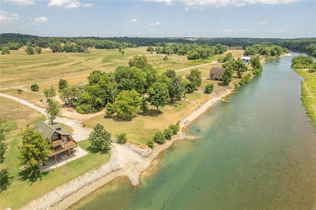 drone / aerial view featuring a water view and a rural view