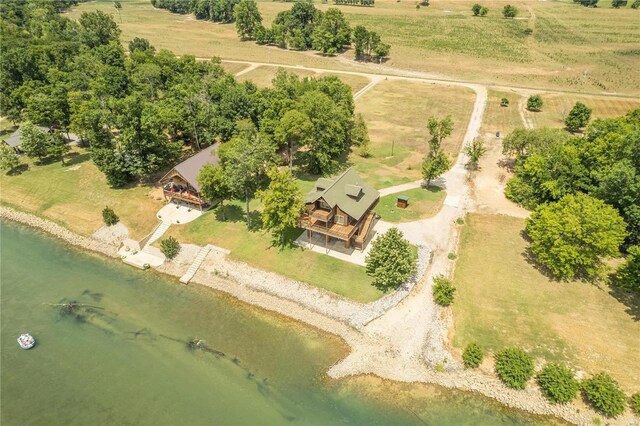 birds eye view of property with a rural view and a water view