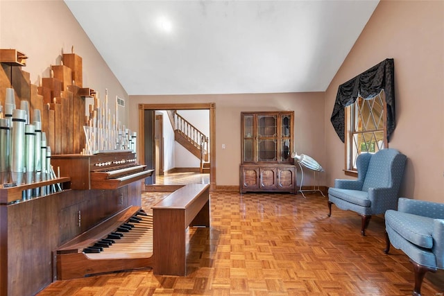 interior space featuring vaulted ceiling and light parquet flooring