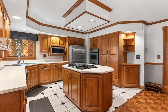 kitchen featuring ornamental molding, a kitchen island, sink, appliances with stainless steel finishes, and light tile patterned flooring