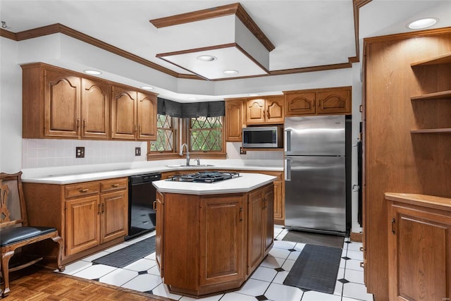 kitchen featuring crown molding, appliances with stainless steel finishes, and a kitchen island