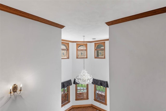 room details featuring a chandelier and ornamental molding