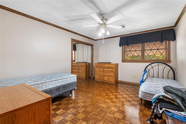 bedroom with ornamental molding, parquet flooring, ceiling fan, and a closet