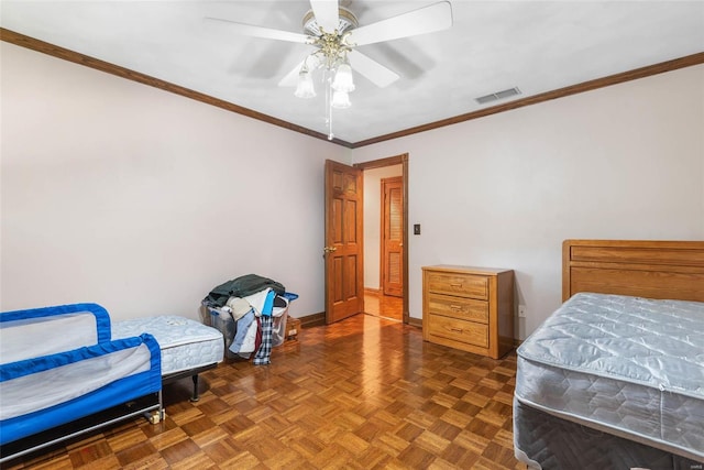 bedroom with ceiling fan, ornamental molding, and dark parquet flooring