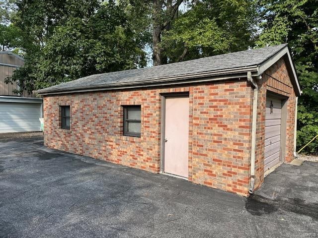 view of outdoor structure with a garage