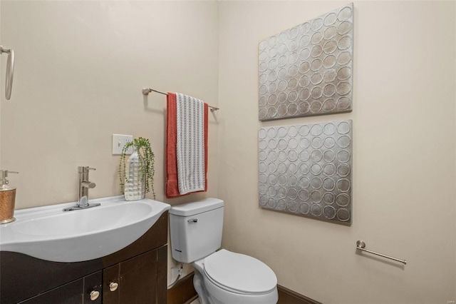 bathroom with toilet and vanity