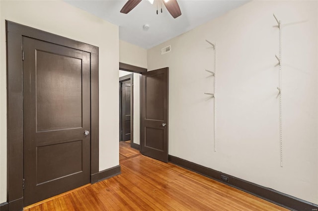 spare room featuring ceiling fan and light hardwood / wood-style floors