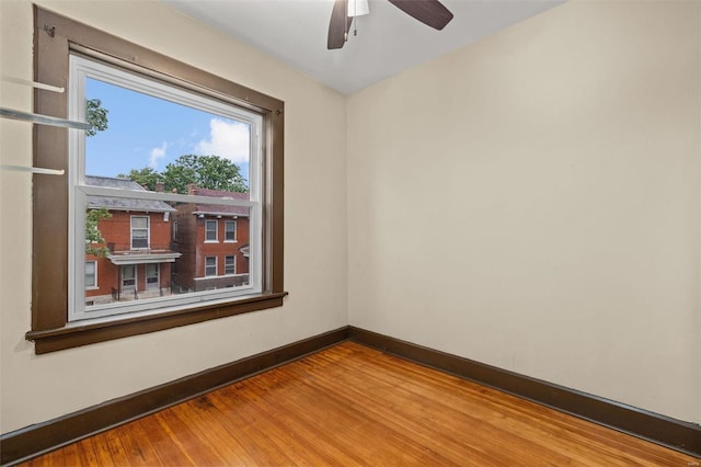 spare room with light hardwood / wood-style flooring and ceiling fan