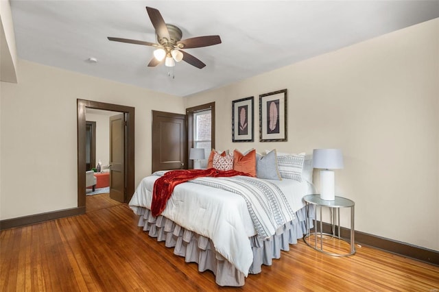 bedroom with hardwood / wood-style flooring and ceiling fan