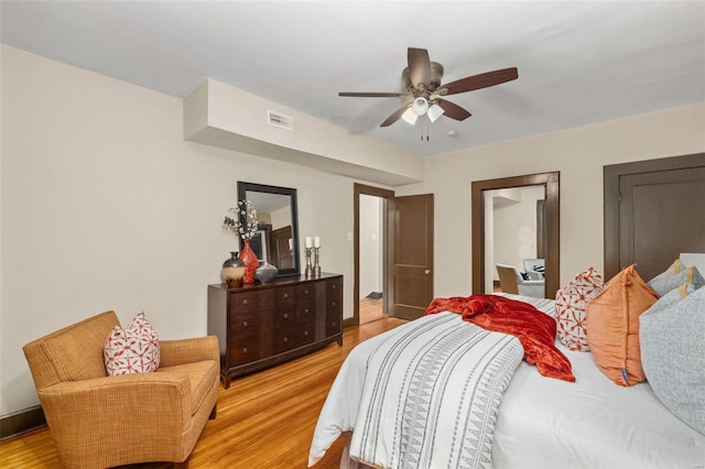 bedroom featuring ceiling fan and light hardwood / wood-style floors