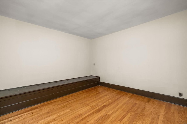 unfurnished room with light wood-type flooring