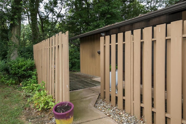 view of gate featuring a wooden deck