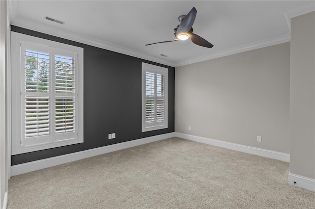 unfurnished room with ceiling fan, ornamental molding, and light colored carpet