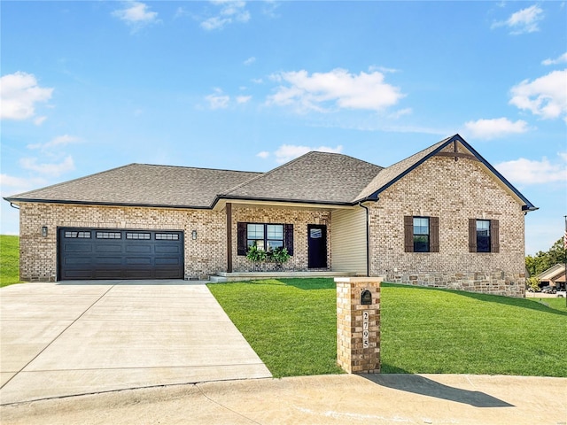 view of front of house featuring a front lawn and a garage