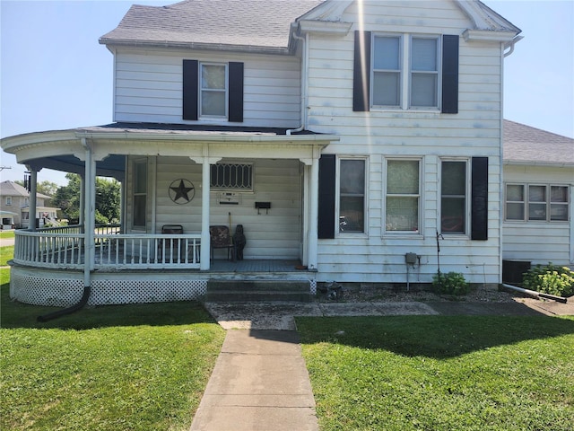 view of front of property featuring a porch and a front lawn