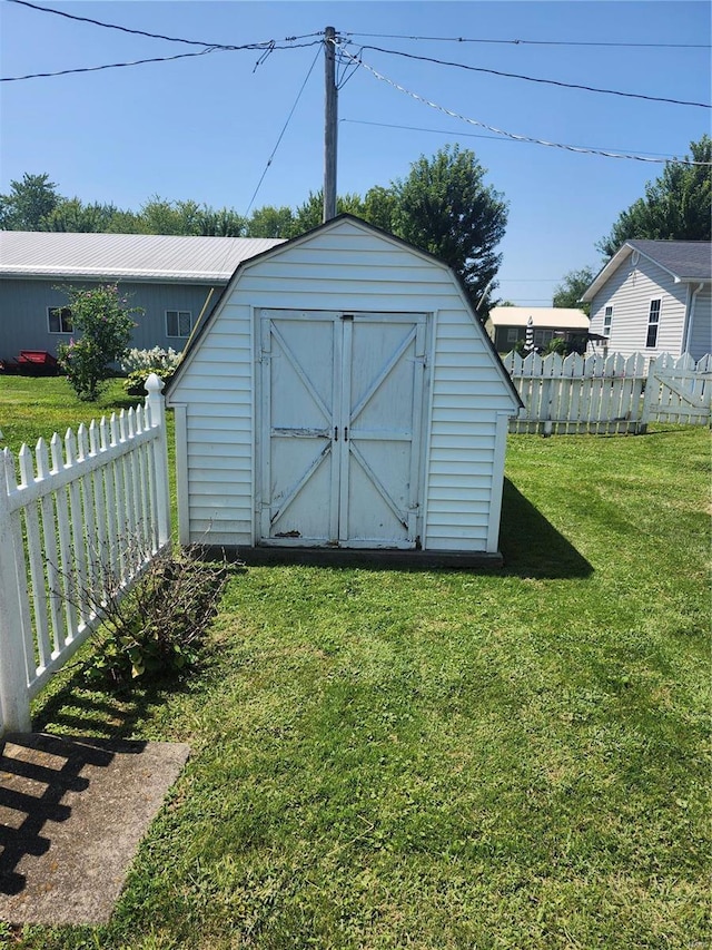 view of outbuilding with a lawn