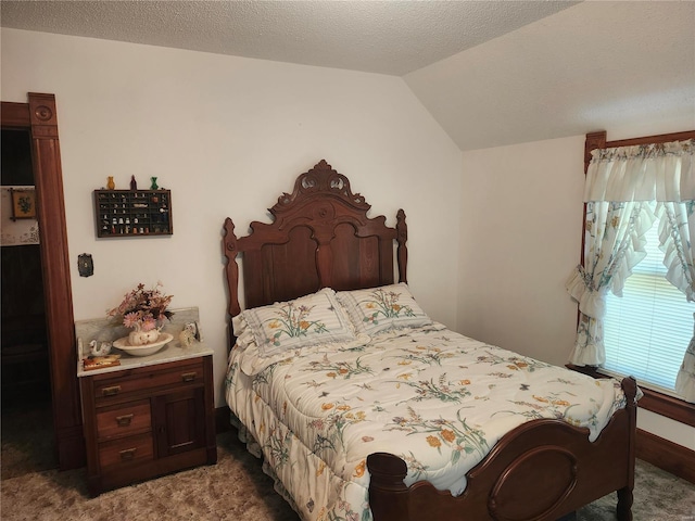 carpeted bedroom featuring lofted ceiling and a textured ceiling