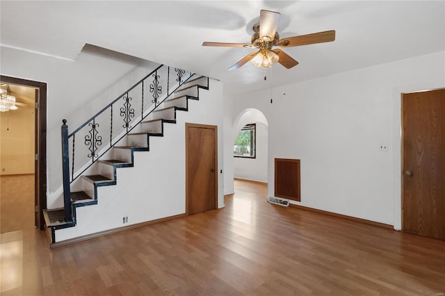 interior space featuring wood-type flooring and ceiling fan