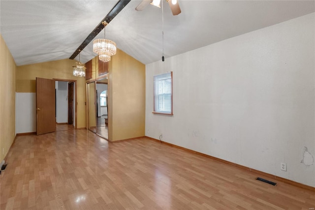 unfurnished living room featuring vaulted ceiling with beams, ceiling fan with notable chandelier, and light hardwood / wood-style floors