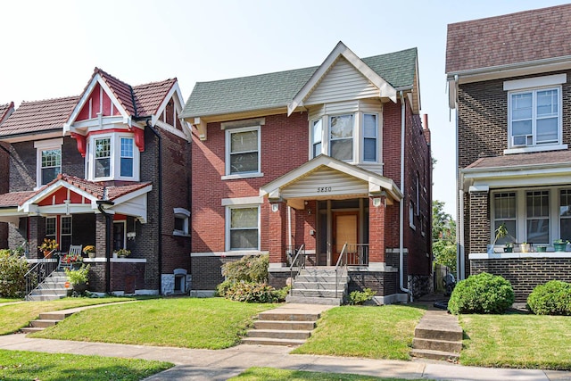 view of front of house with a front yard and a porch