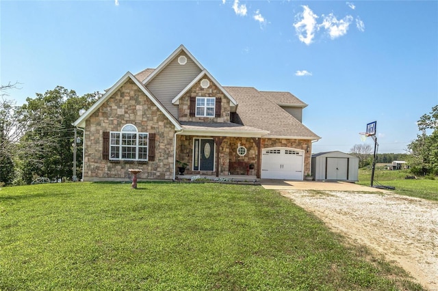 view of front of home featuring a garage, a front lawn, and an outdoor structure