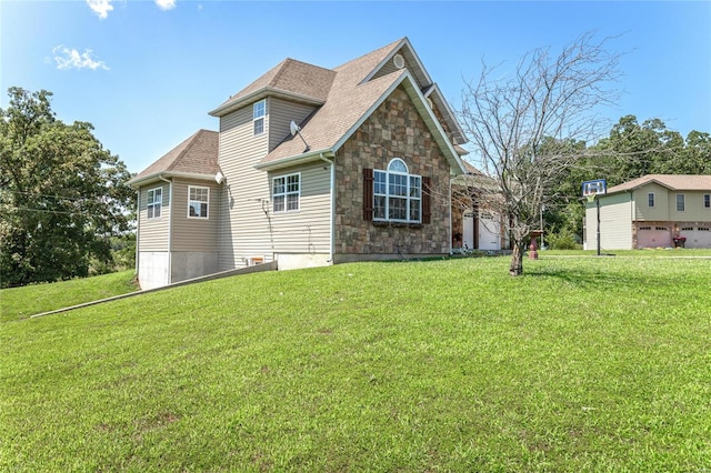 front facade featuring a garage and a front lawn