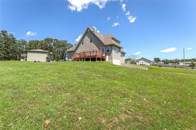 back of property featuring a yard and a deck