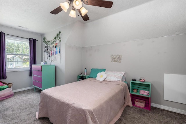 carpeted bedroom with a textured ceiling and ceiling fan